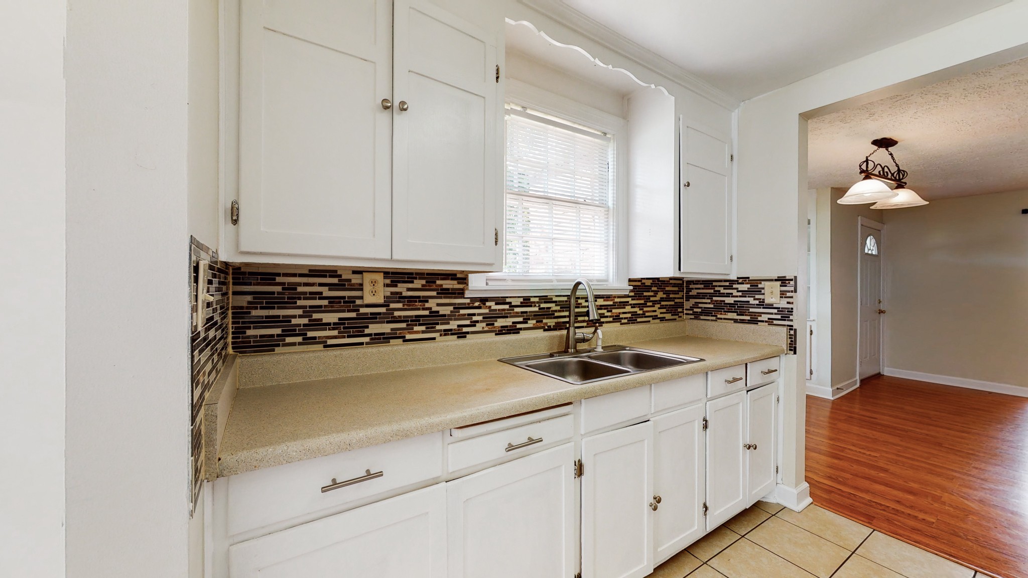 343 Neelys Bend Road Madison, TN 37115 - Photo 8 of 28 a kitchen with a sink and cabinets