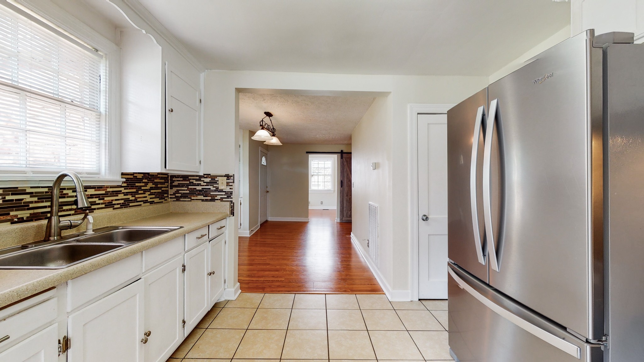 343 Neelys Bend Road Madison, TN 37115 - Photo 10 of 28 a kitchen with stainless steel appliances a refrigerator and a sink