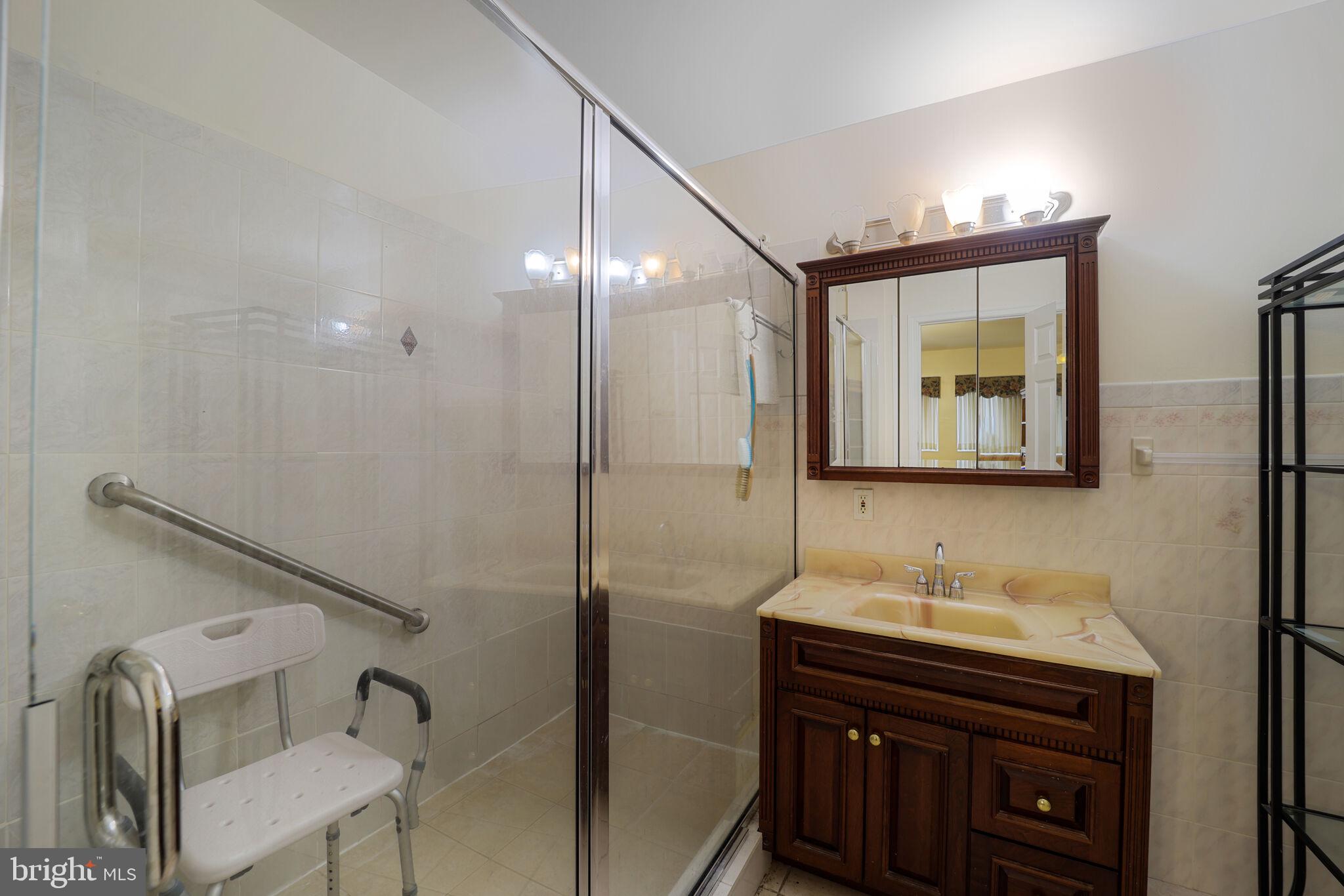 1410 Missouri Avenue Northwest Washington, DC 20011 - Photo 11 of 38 a bathroom with a sink vanity and mirror