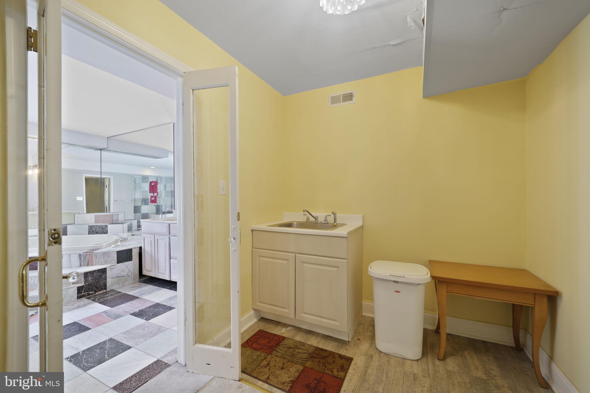 1410 Missouri Avenue Northwest Washington, DC 20011 - Photo 15 of 38 a spacious bathroom with a sink and a mirror