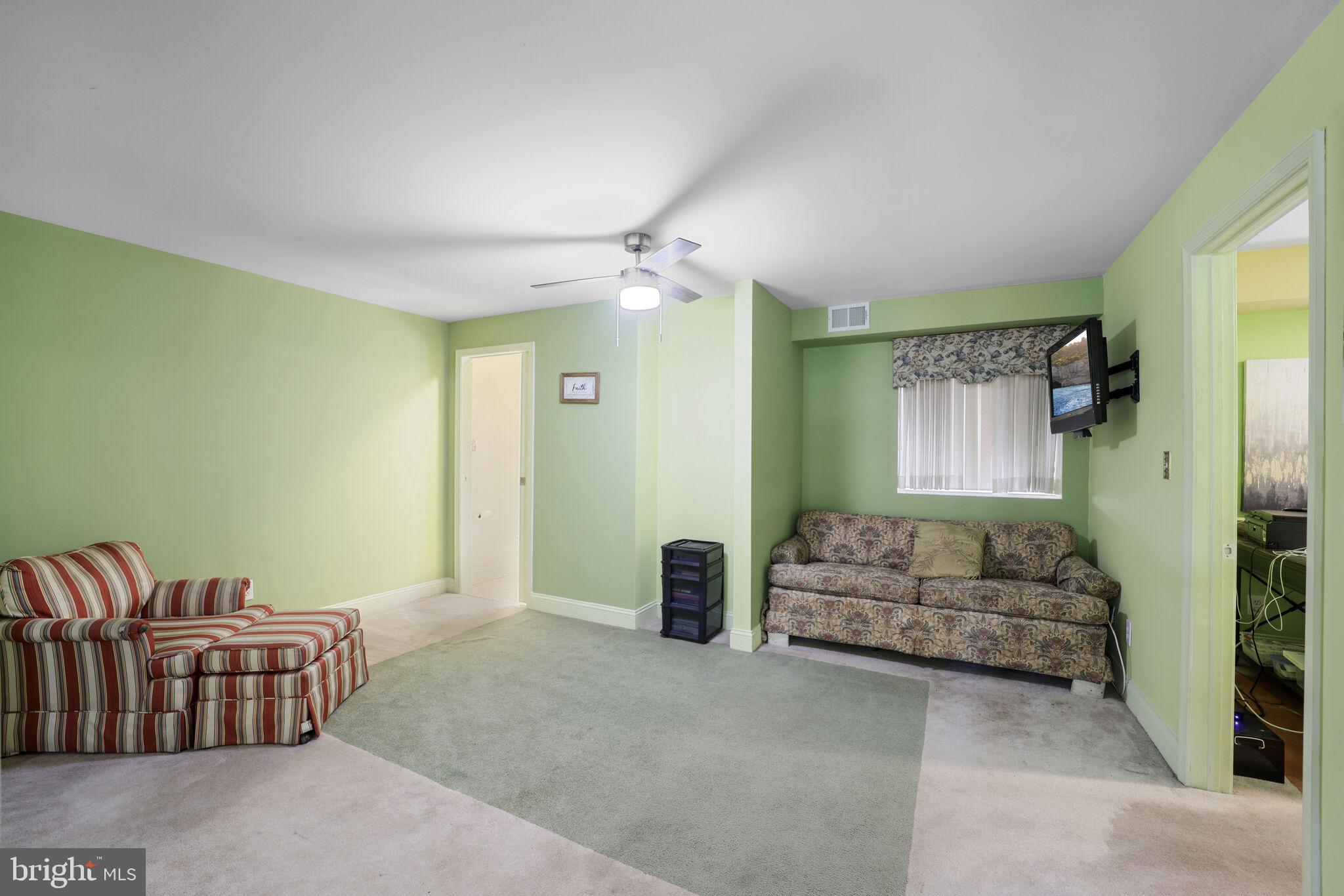 1410 Missouri Avenue Northwest Washington, DC 20011 - Photo 19 of 38 a bedroom with furniture and a ceiling fan