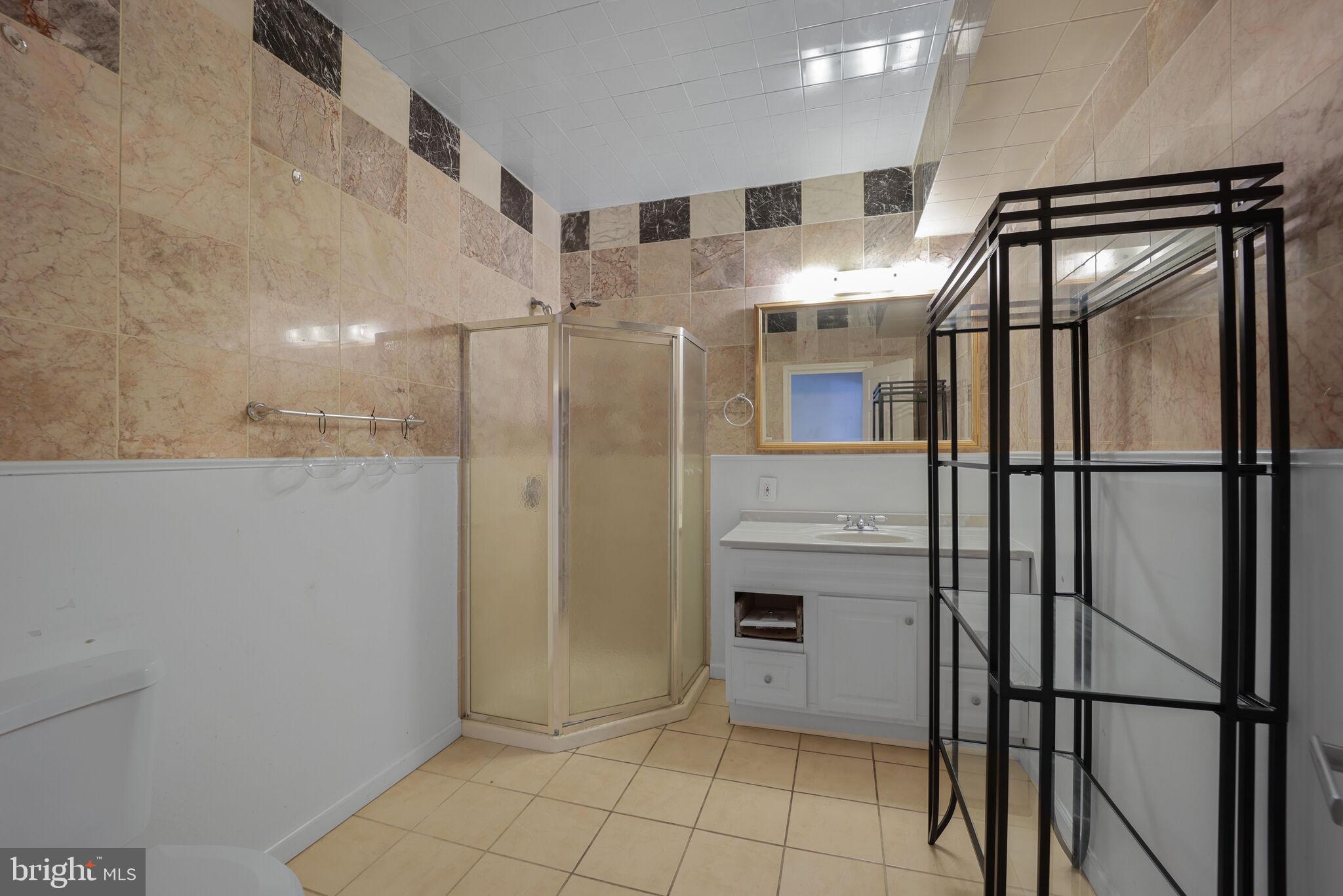 1410 Missouri Avenue Northwest Washington, DC 20011 - Photo 22 of 38 a bathroom with a shower and closet