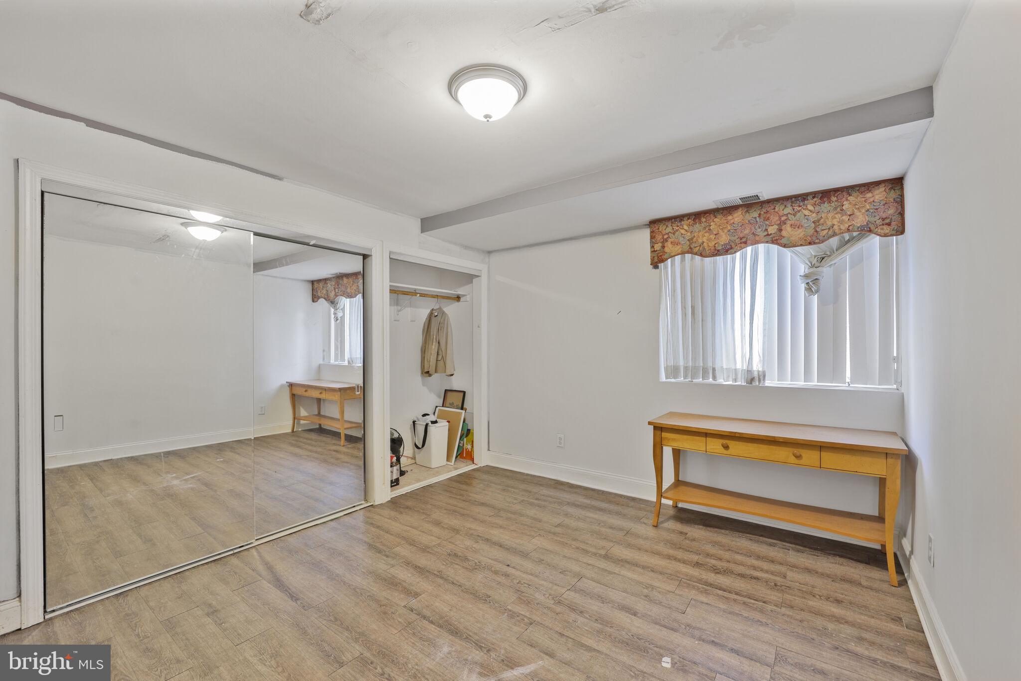 1410 Missouri Avenue Northwest Washington, DC 20011 - Photo 23 of 38 a view of a room with wooden floor lounge chair and windows
