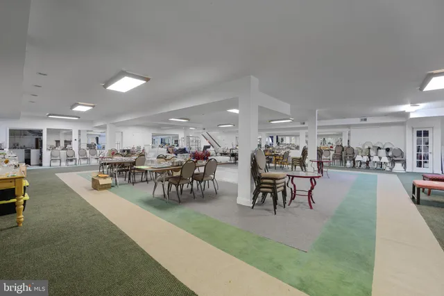 a kitchen with a sink cabinets and stainless steel appliances