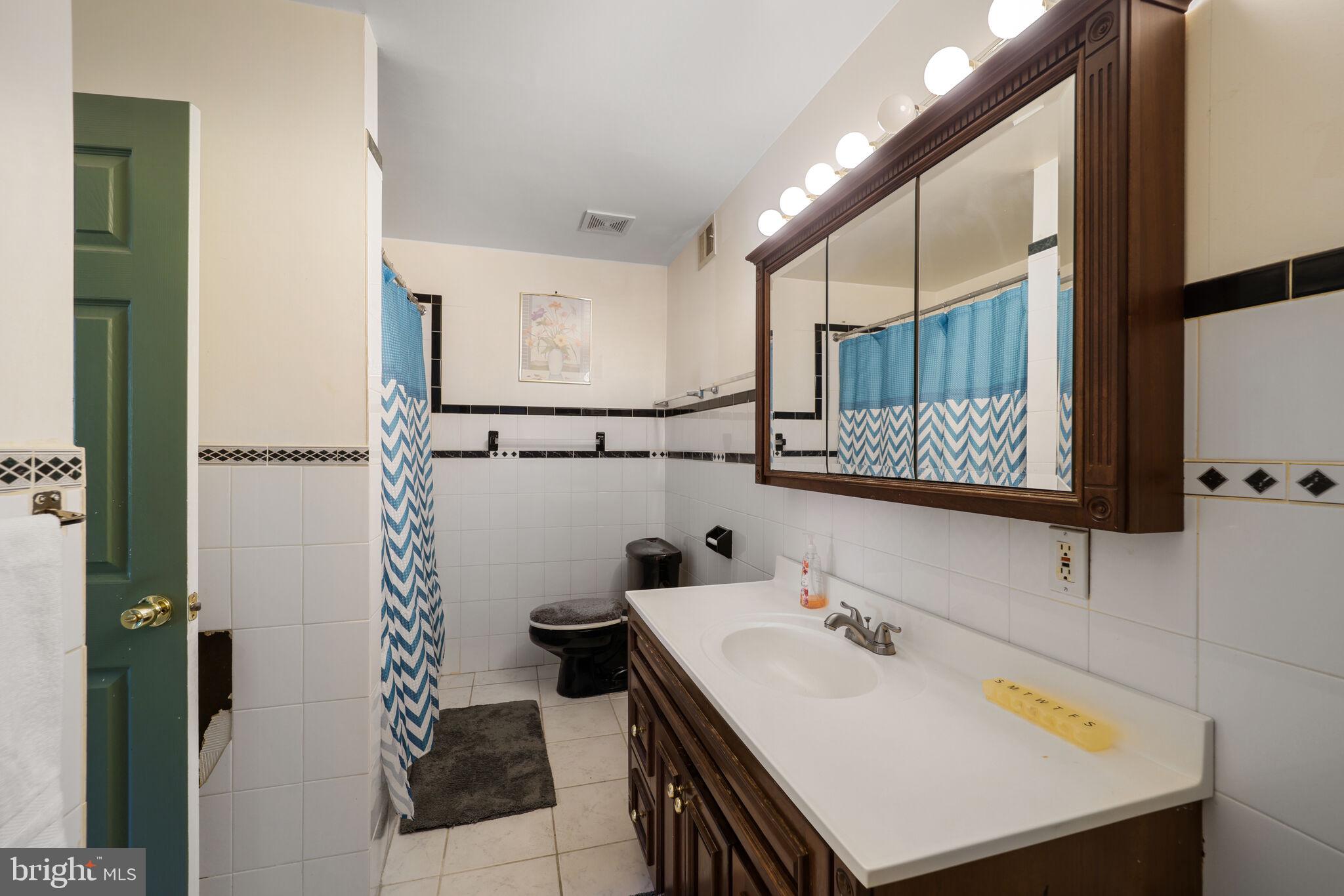 1410 Missouri Avenue Northwest Washington, DC 20011 - Photo 26 of 38 a bathroom with a sink and a mirror