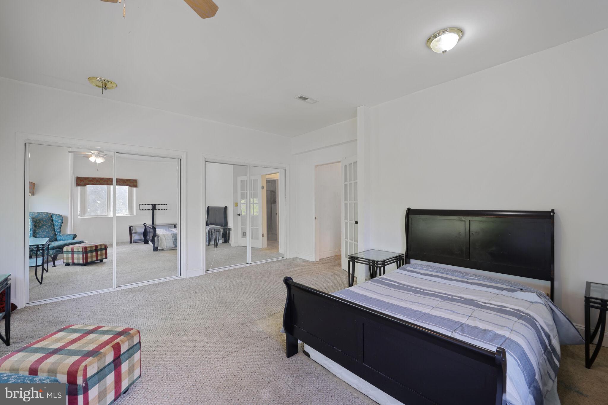 1410 Missouri Avenue Northwest Washington, DC 20011 - Photo 27 of 38 a bedroom with a bed and a couch