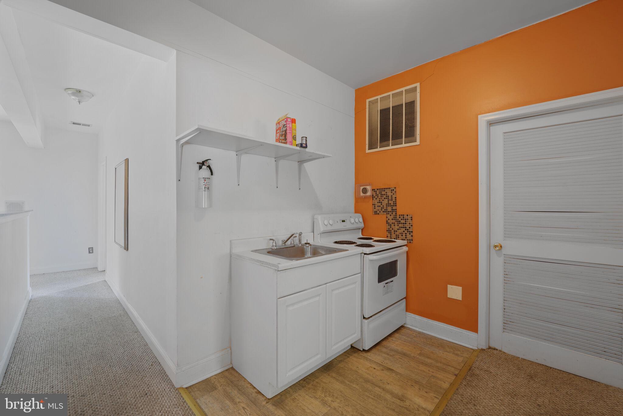 1410 Missouri Avenue Northwest Washington, DC 20011 - Photo 28 of 38 a kitchen with a stove and a refrigerator