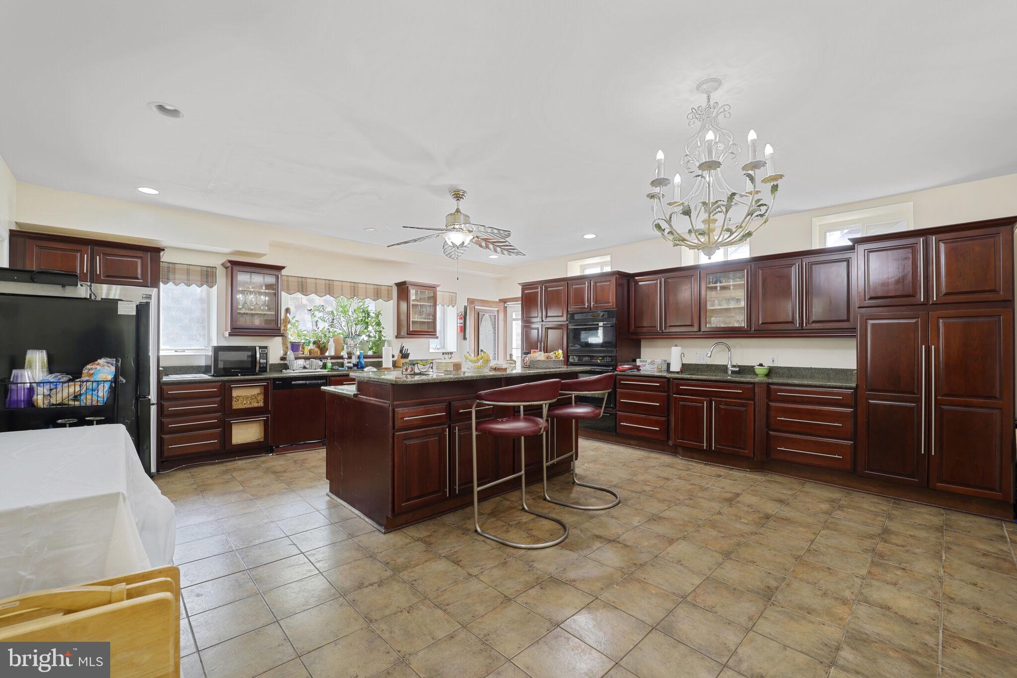1410 Missouri Avenue Northwest Washington, DC 20011 - Photo 8 of 38 a kitchen with stainless steel appliances wooden cabinets and center island