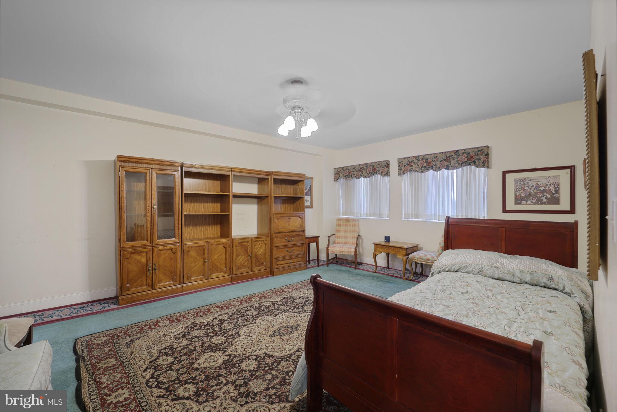 1410 Missouri Avenue Northwest Washington, DC 20011 - Photo 10 of 38 a bedroom with a bed and dresser with wooden floor