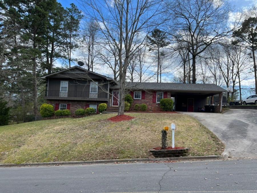 103 Hycliff Road Southwest Rome, GA 30165 - Photo 1 of 1 a front view of a house with a yard