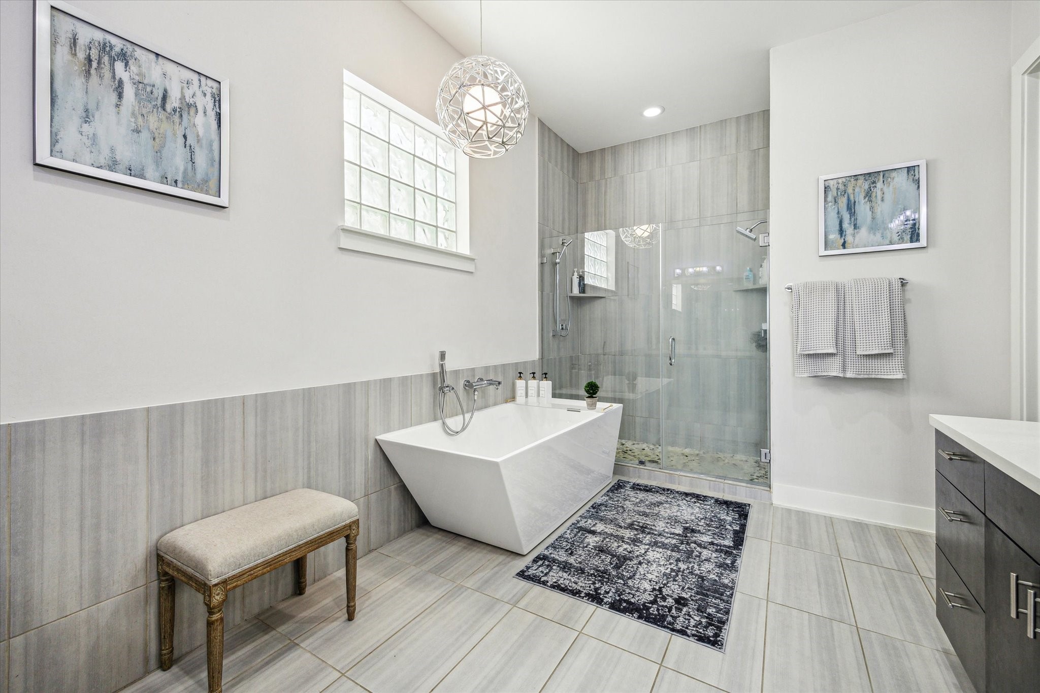 1505 Detering Street Houston, TX 77007 - Photo 19 of 27 a bathroom with a sink mirror and a bath tub
