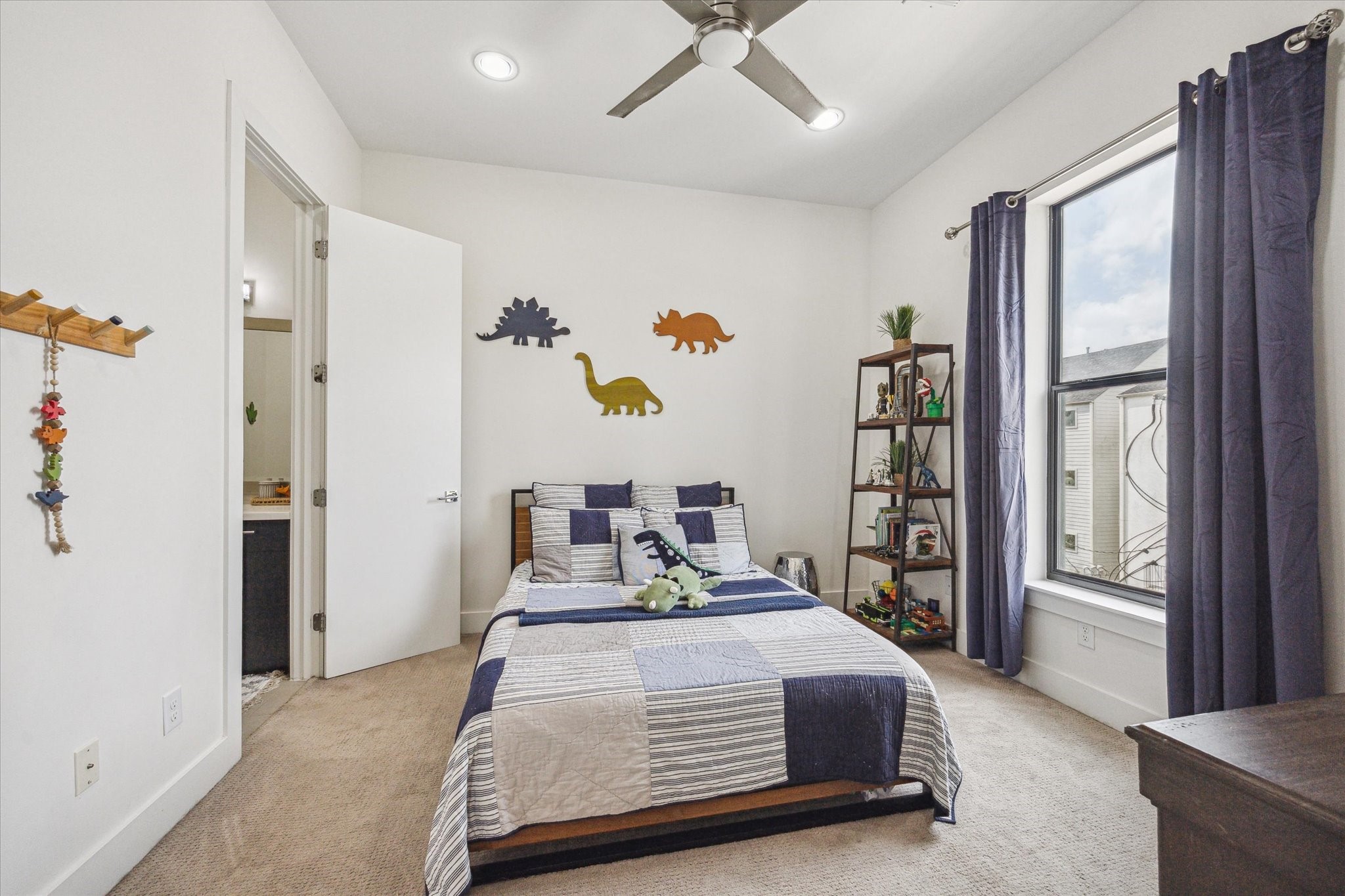 1505 Detering Street Houston, TX 77007 - Photo 21 of 27 a bedroom with a bed and a window