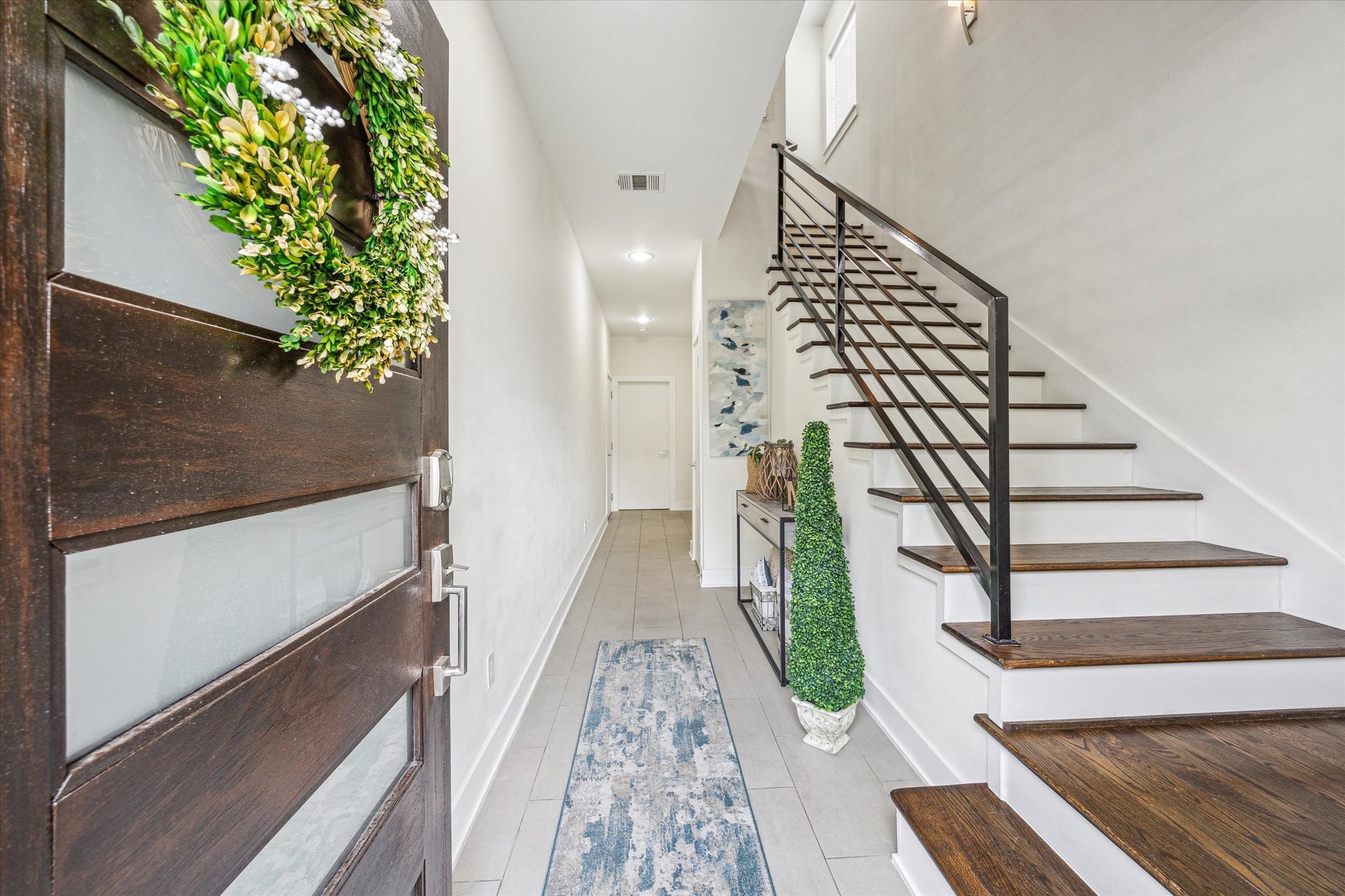 1505 Detering Street Houston, TX 77007 - Photo 3 of 27 a view of entryway with wooden floor