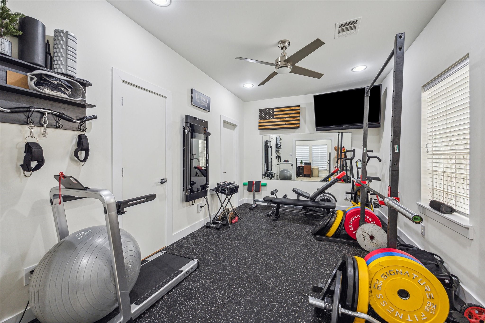 1505 Detering Street Houston, TX 77007 - Photo 6 of 27 a room with gym equipment and a window