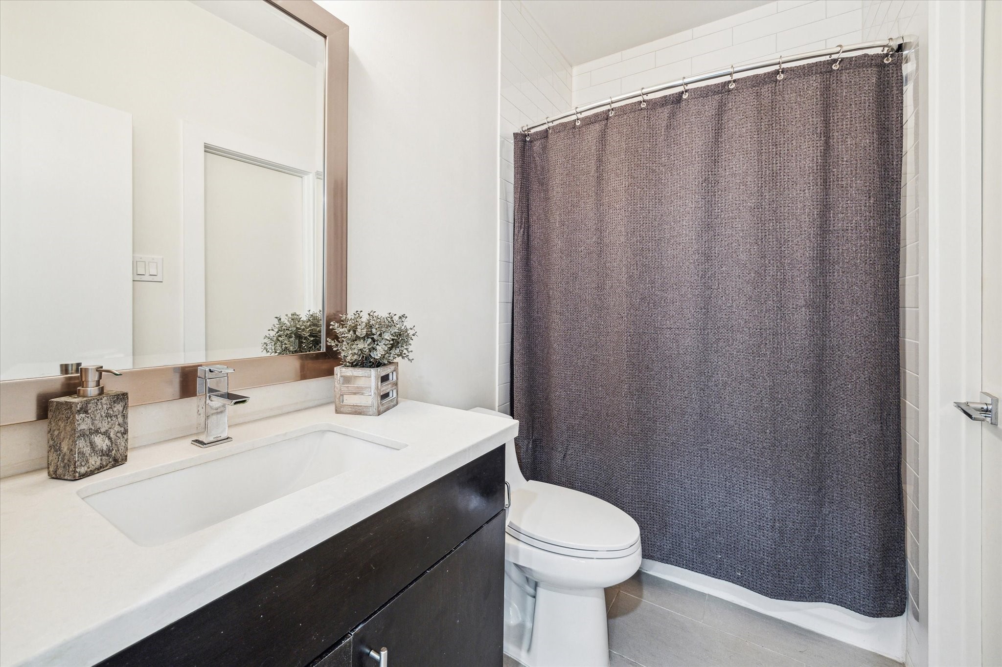 1505 Detering Street Houston, TX 77007 - Photo 7 of 27 a bathroom with a sink a toilet and shower