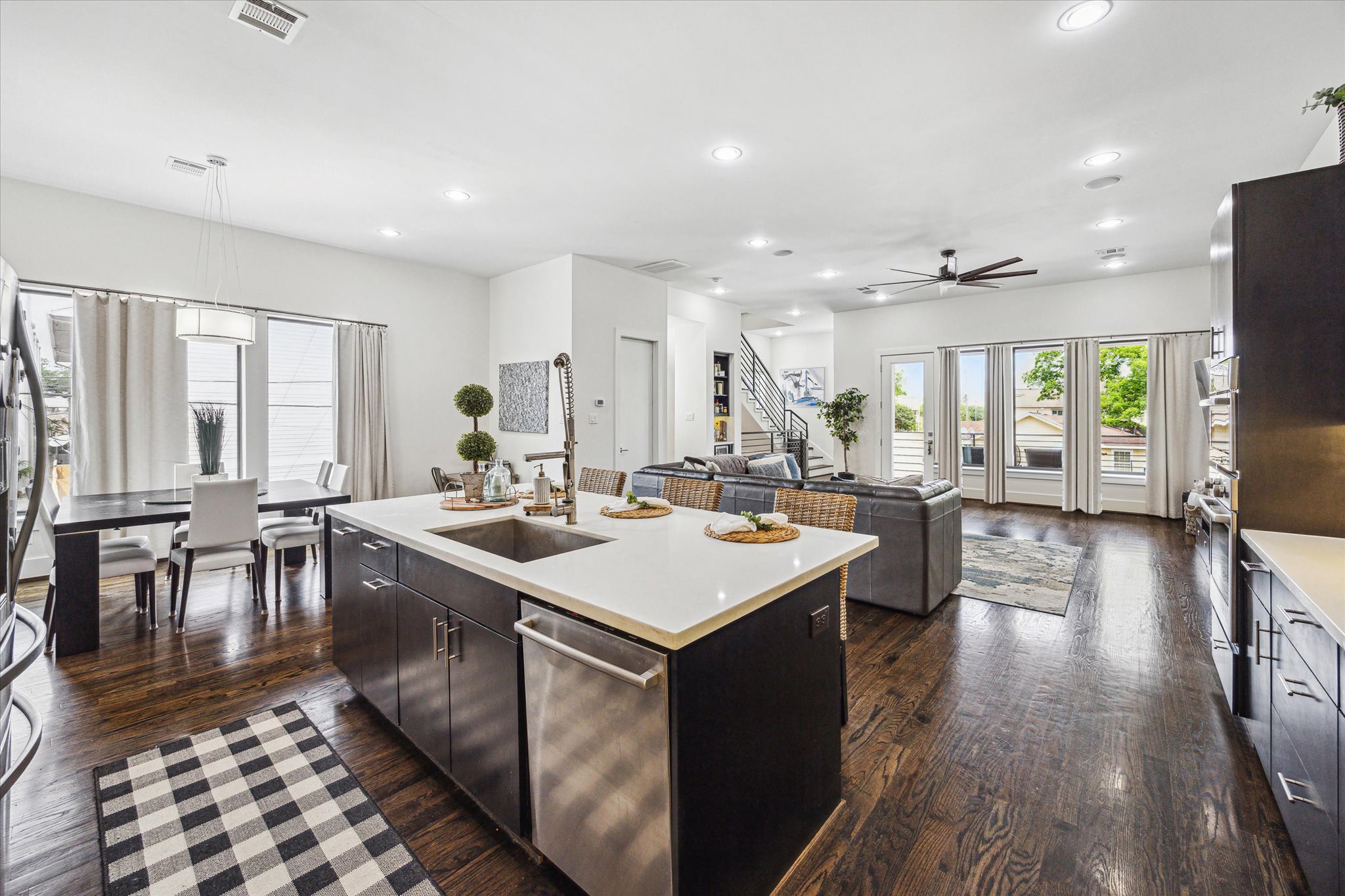 1505 Detering Street Houston, TX 77007 - Photo 10 of 27 a kitchen with counter top space sink stove and wooden floor