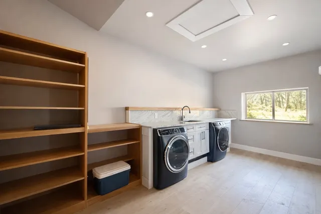 a view of a storage & utility room with washer and dryer