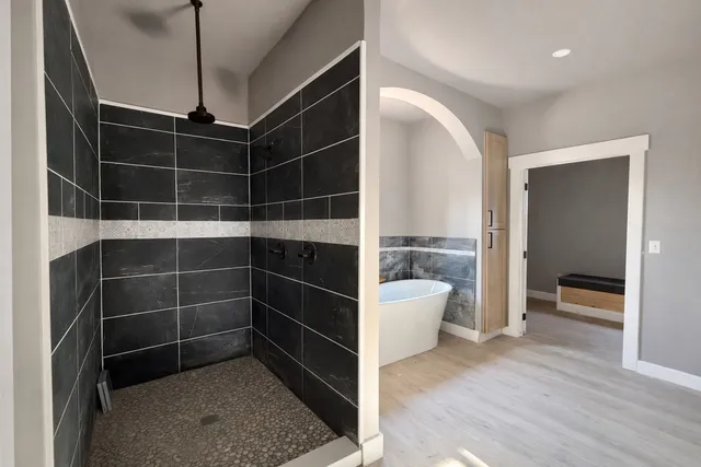 a view of an empty room with a fireplace