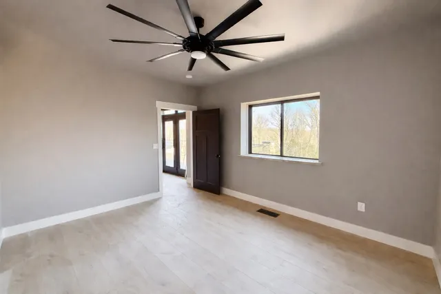 a bathroom with a bathtub and window