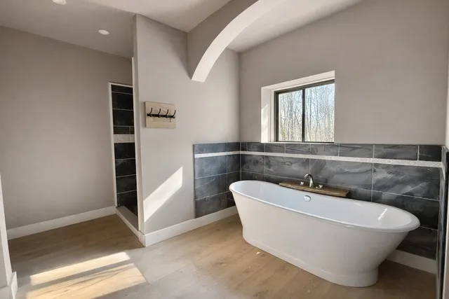 a view of a room with window and entryway