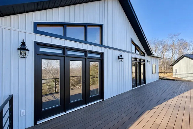 a view of lake with mountain and trees