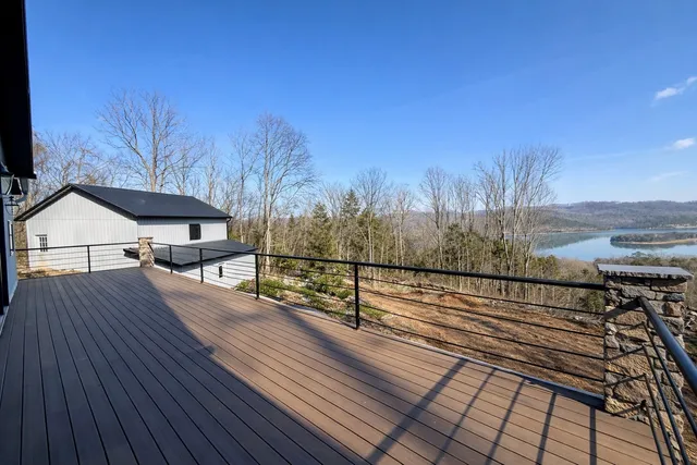 a view of a lake in middle of forest