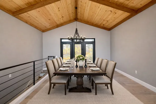 a view of a dining room with furniture window and outside view