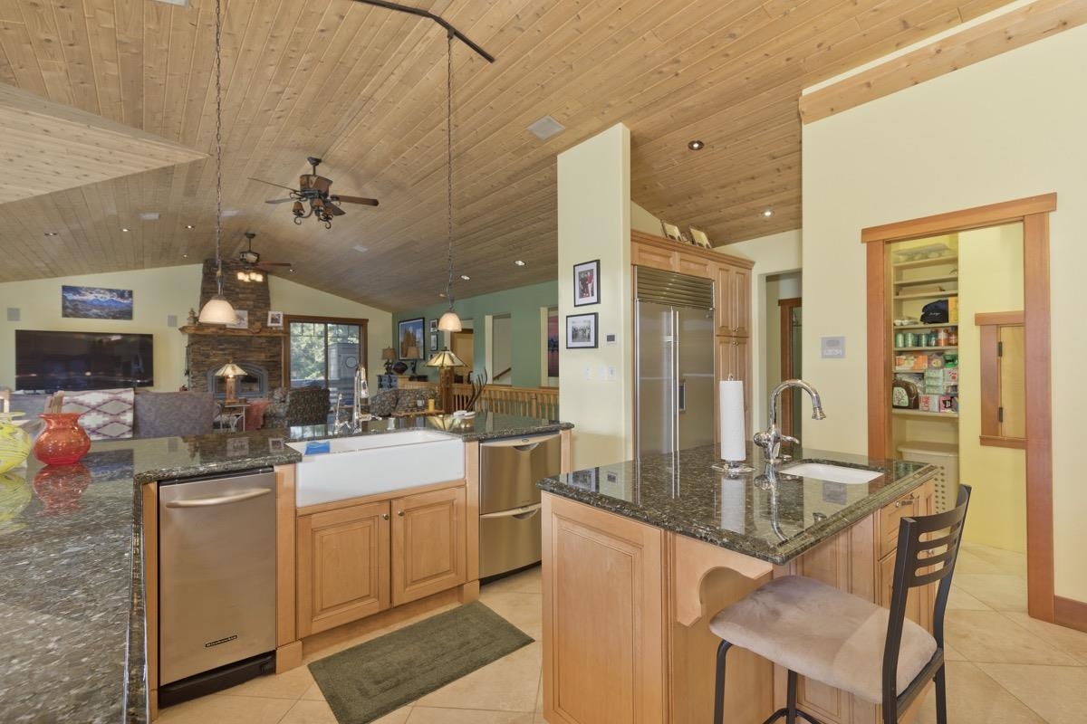 2500 Old Mammoth Road Mammoth Lakes, CA 93546 - Photo 22 of 48 a kitchen with sink refrigerator and cabinets
