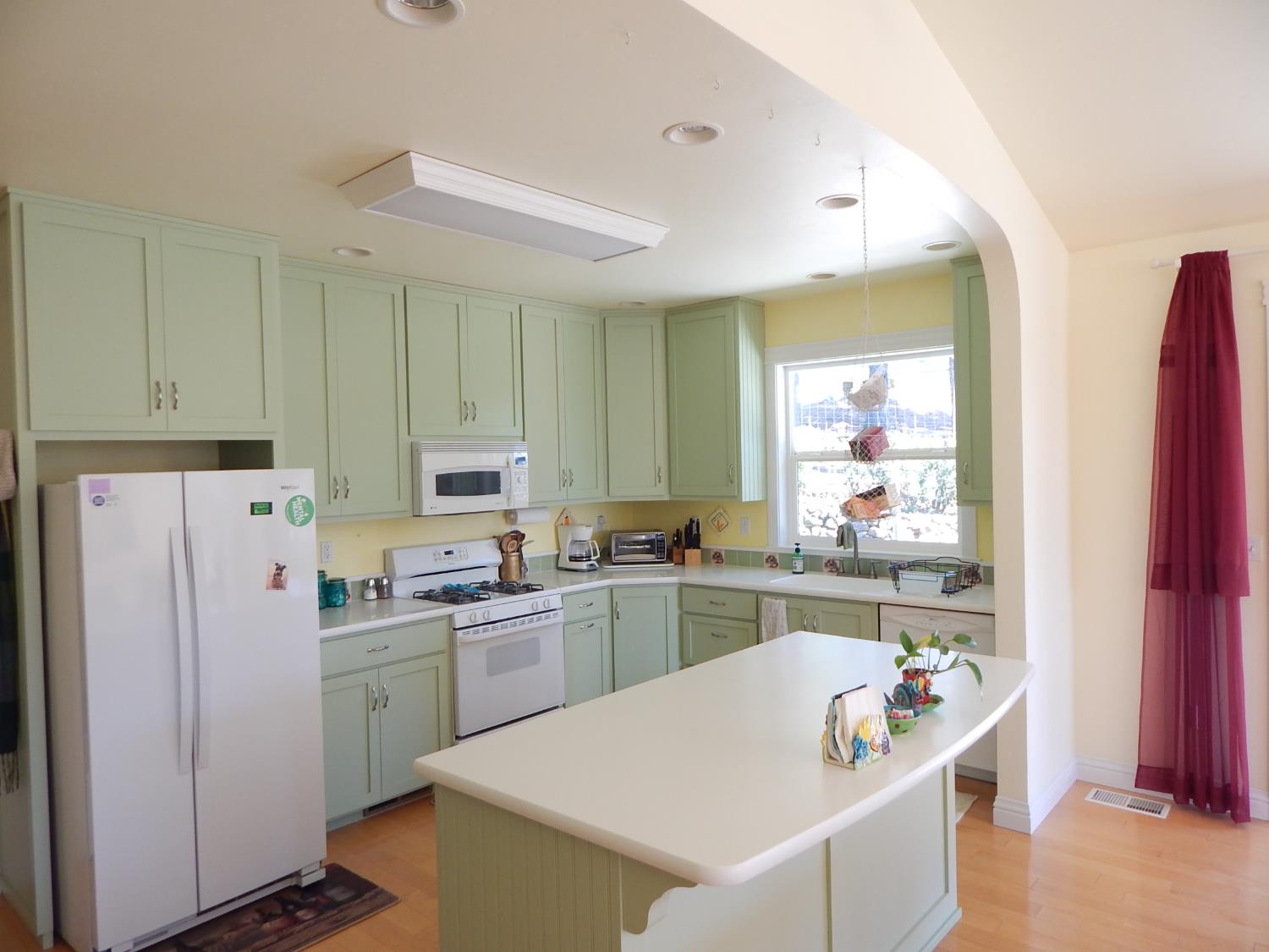 1717 Union Ridge Road Placerville, CA 95667 - Photo 14 of 55 a kitchen with refrigerator and cabinets