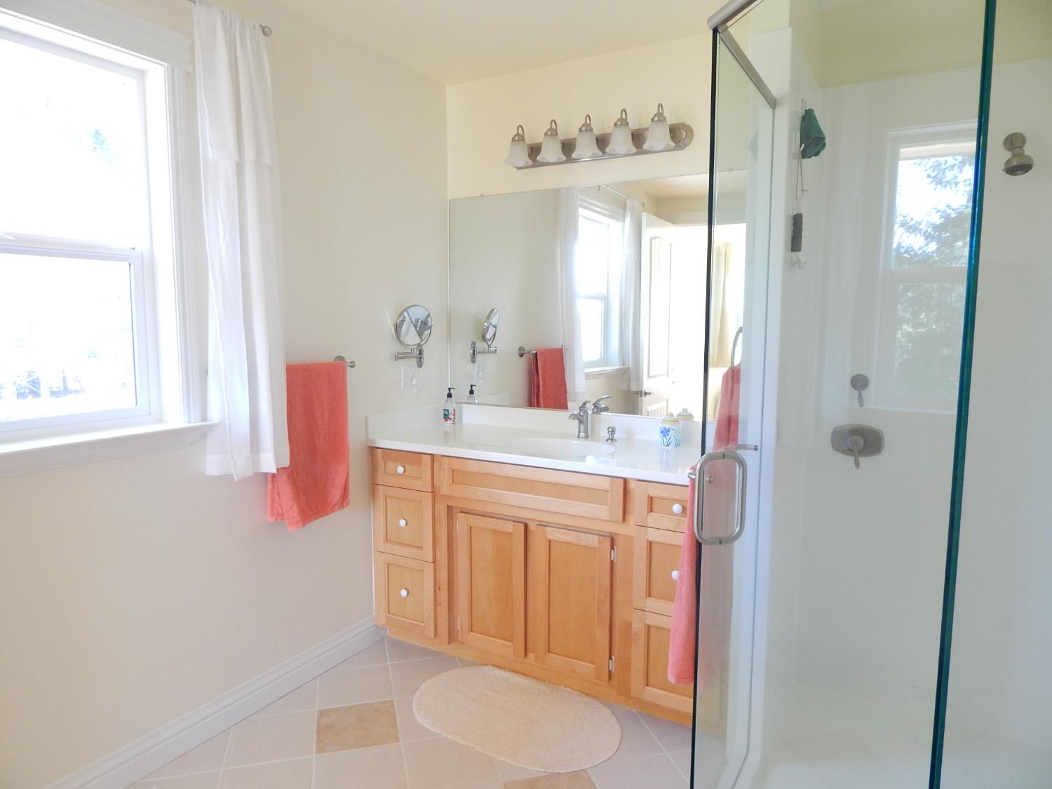 1717 Union Ridge Road Placerville, CA 95667 - Photo 20 of 55 a bathroom with a sink vanity granite and a mirror