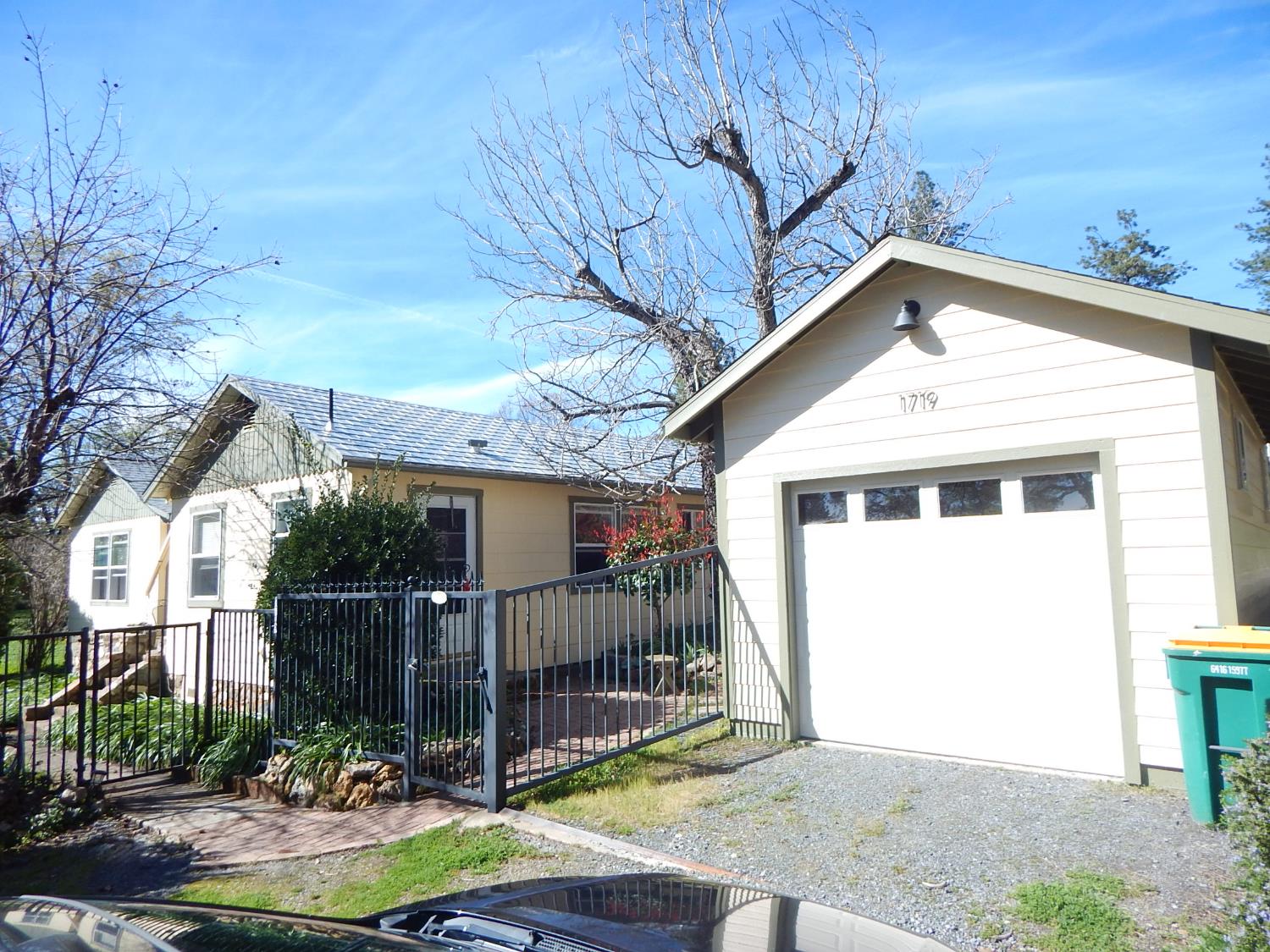 1717 Union Ridge Road Placerville, CA 95667 - Photo 33 of 55 a view of a small house with a small yard and wooden fence