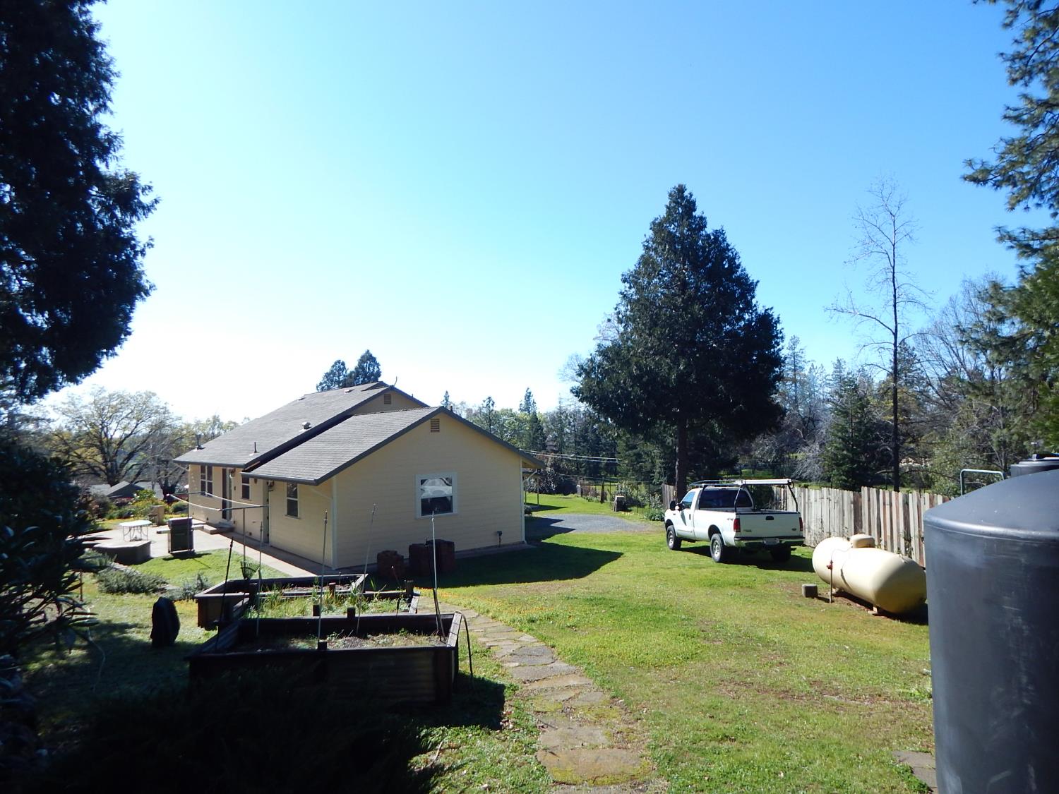 1717 Union Ridge Road Placerville, CA 95667 - Photo 9 of 55 a car parked in front of a house with wooden fence