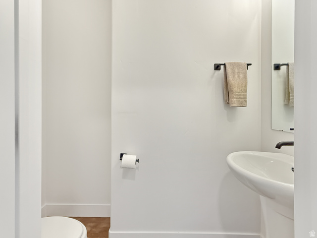 641 Desert Willow Drive Mapleton, UT 84664 - Photo 12 of 41 Half bathroom with toilet and baseboards