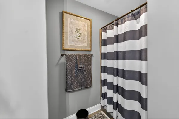 a bathroom with a bathtub and shower