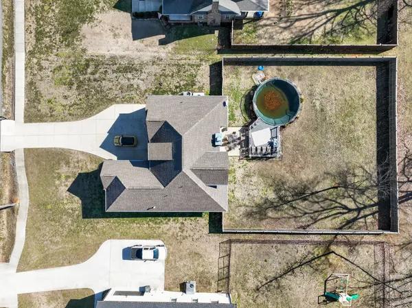 a aerial view of a kitchen has a stove and a chair