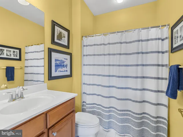 a bedroom with a bed and a desk