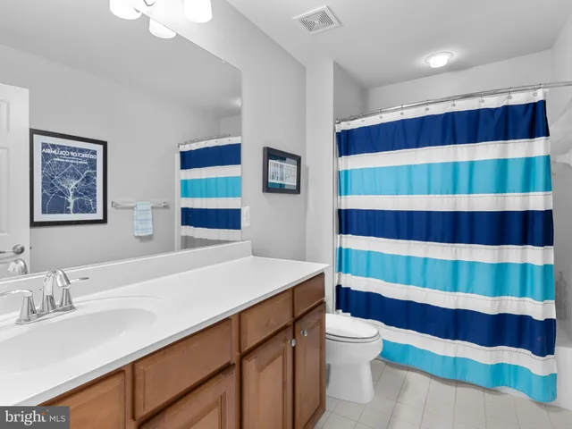 a bedroom with furniture and a chandelier