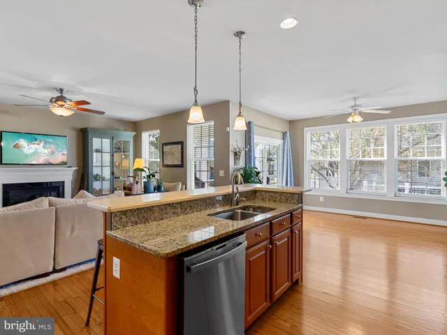 a kitchen with center island table and chairs
