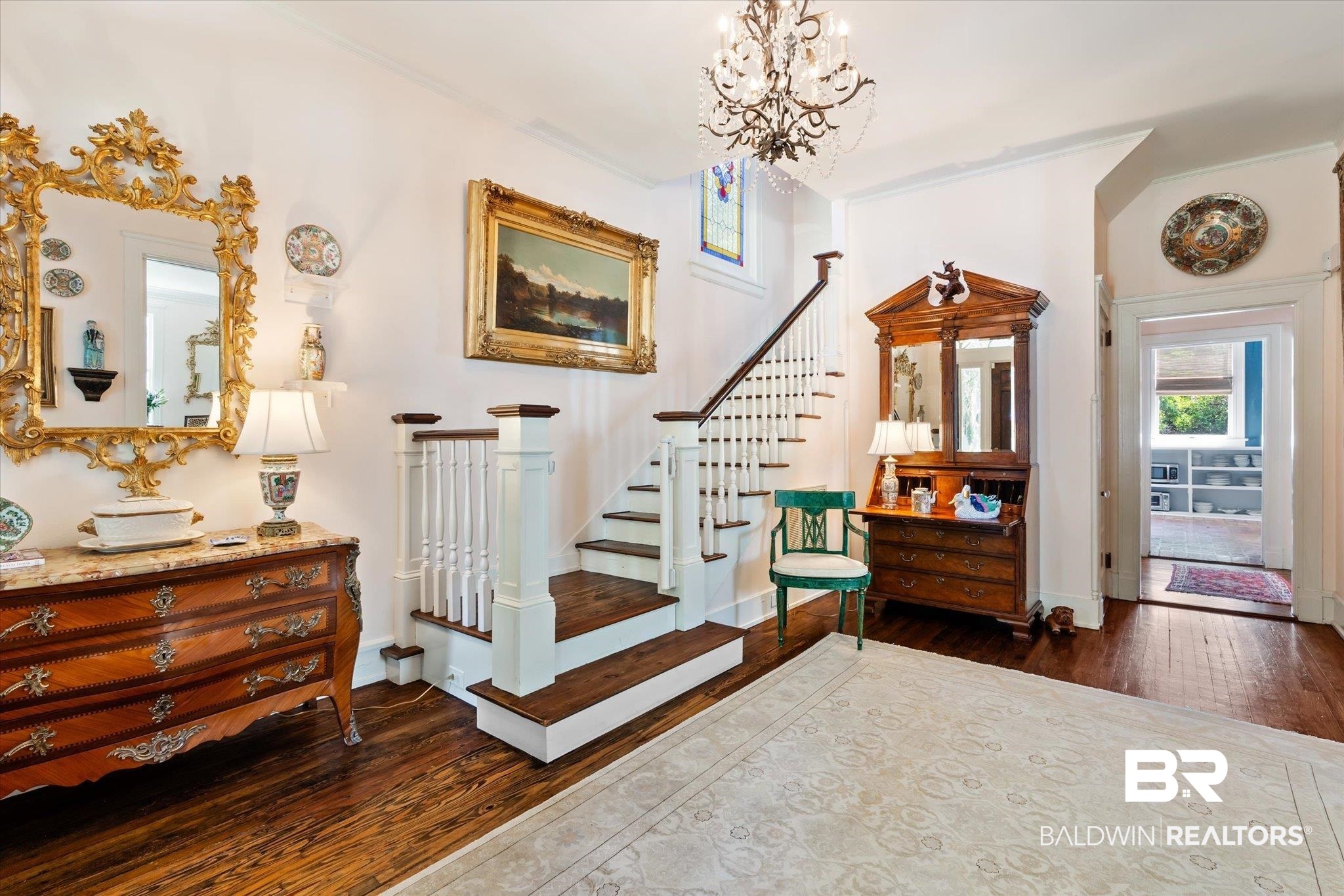68 North Monterey Street Mobile, AL 36604 - Photo 4 of 30 Entrance foyer featuring dark hardwood / wood-style floors and an inviting chandelier