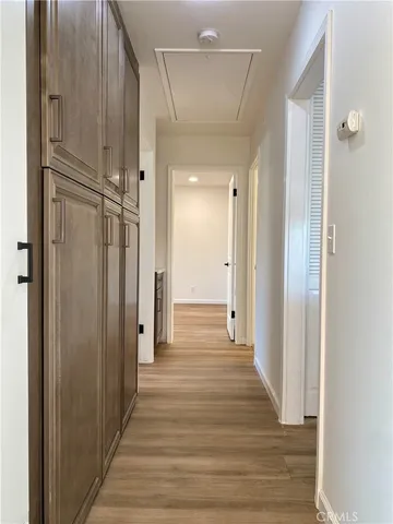 a view of a hallway with a front door