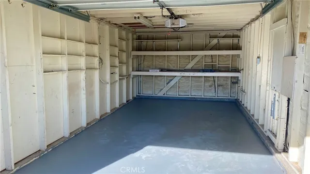 a view of a house with pool and chairs