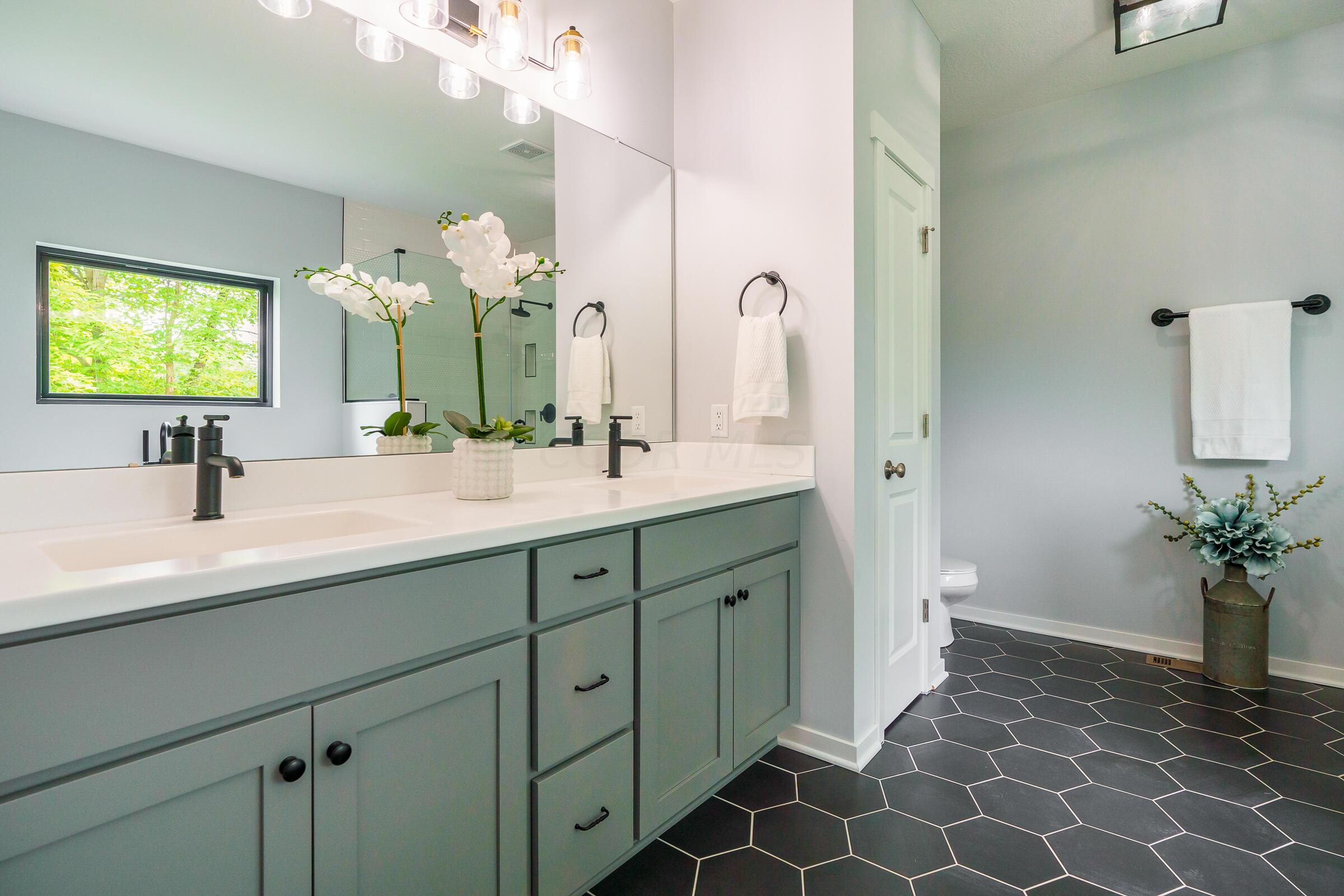 701 Ross Road Sunbury, OH 43074 - Photo 31 of 74 Spa-like en suite with dual sinks and gorgeous tile flooring