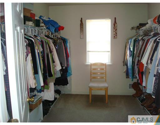48 Lexington Road Monmouth Junction, NJ 08852 - Photo 14 of 18 a view of walk in closet with clothes