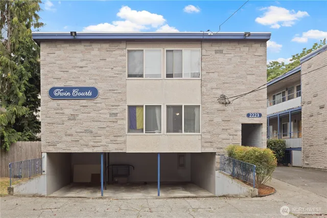 a brick building with a sign on it