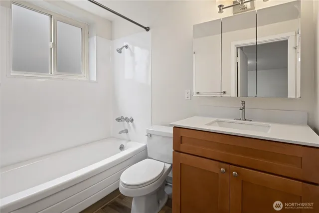 a bathroom with a sink a toilet and a bathtub