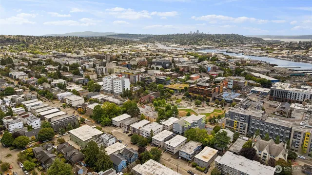 an aerial view of residential building with parking