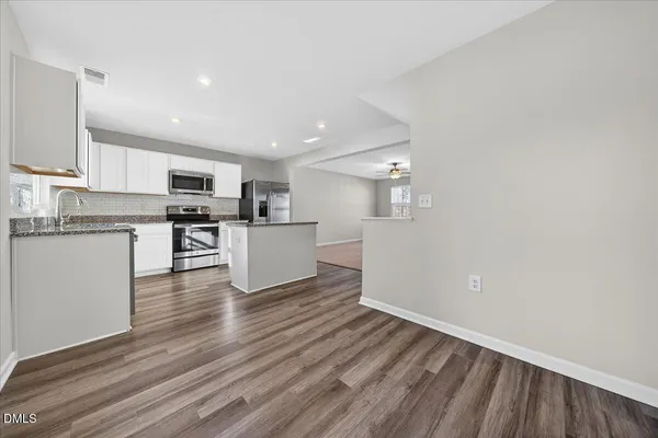 a view of kitchen with wooden floor
