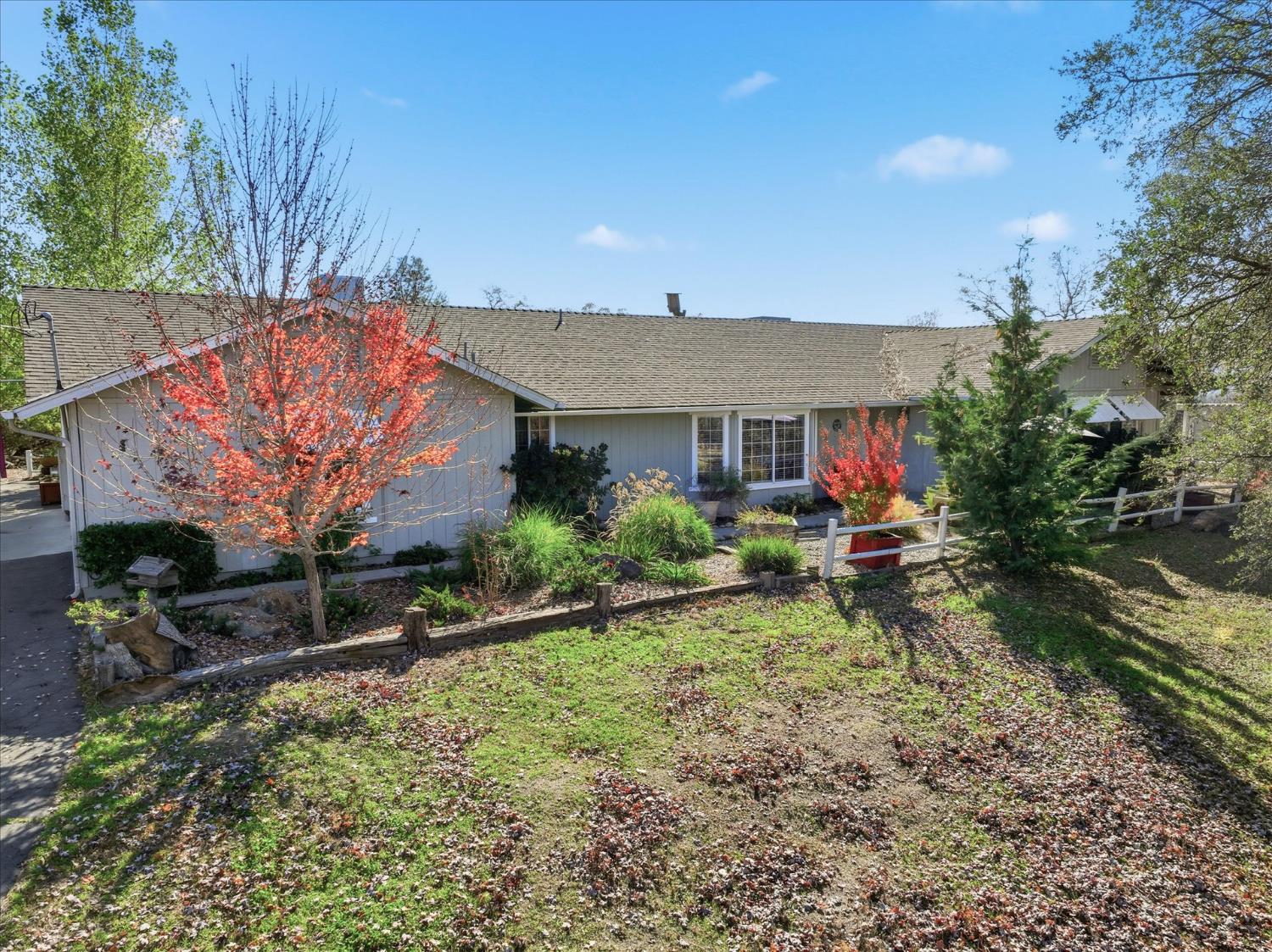 32583 River Knolls Road Coarsegold, CA 93614 - Photo 3 of 63 a view of a house with a yard and sitting area