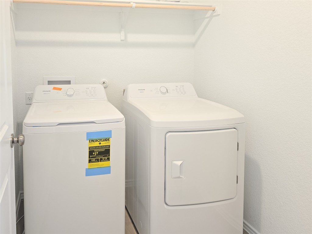 1117 Nesting Bird Drive Georgetown, TX 78628 - Photo 11 of 20 a utility room with dryer and washer