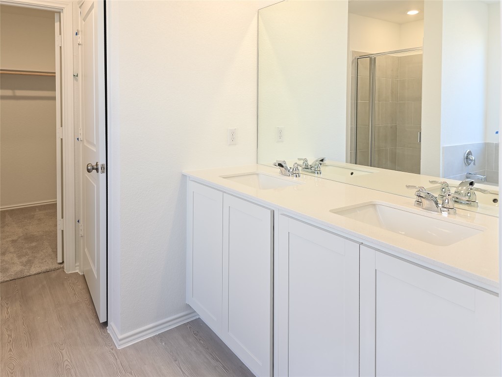 1117 Nesting Bird Drive Georgetown, TX 78628 - Photo 13 of 20 a bathroom with a sink and a mirror